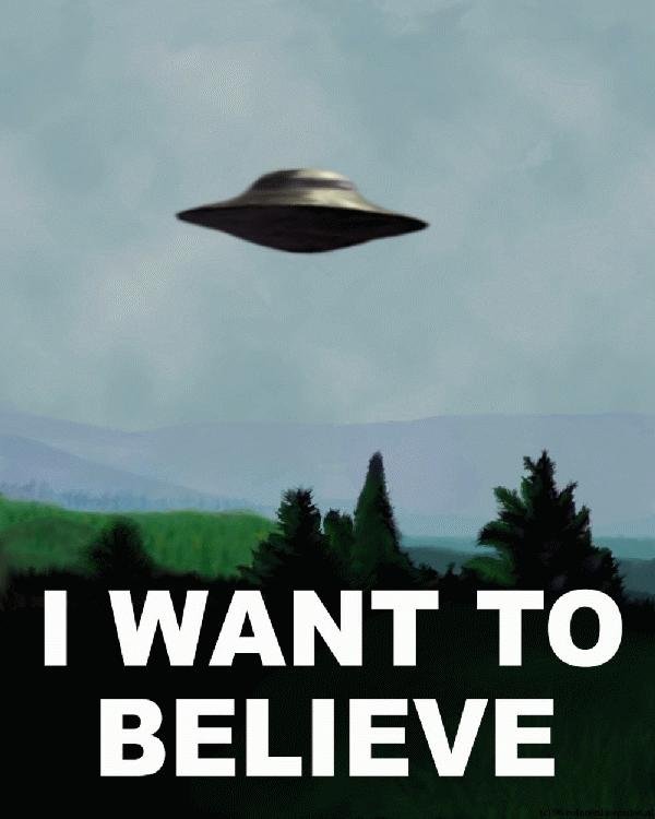 A picture of a stereotypical flying saucer over a field with the caption "I want to believe".