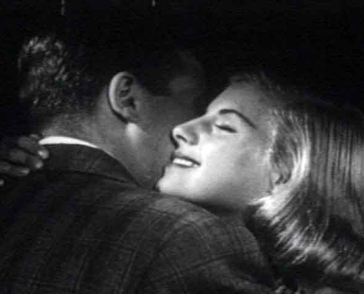 Black & White photo of a couple embracing, from circa 1950s.